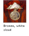 Bronze inlaid logo with shell