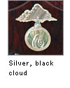 Silver inlaid with black mop
