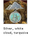 silver inlaid logo with turquoise
