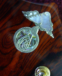 Inlaid logo with shell
